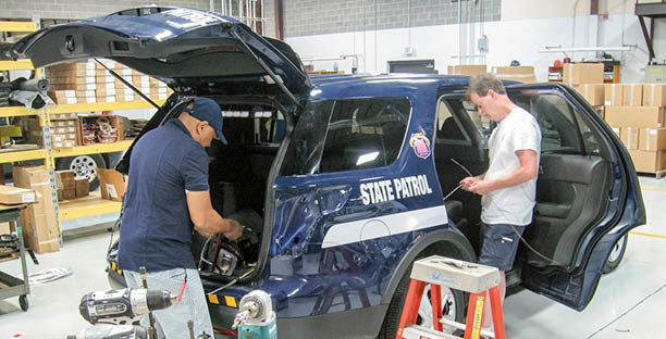 new suv marked cruiser being set up at the fleet installation center