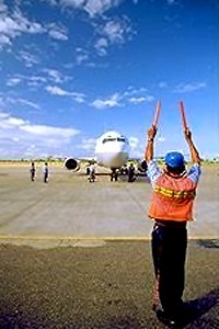 Airliner being parked at a terminal