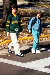 Children crossing road in crosswalk