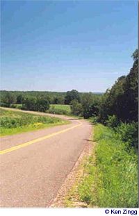 A gentle downhill corner on Rustic Road 6