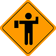 Flagger ahead sign